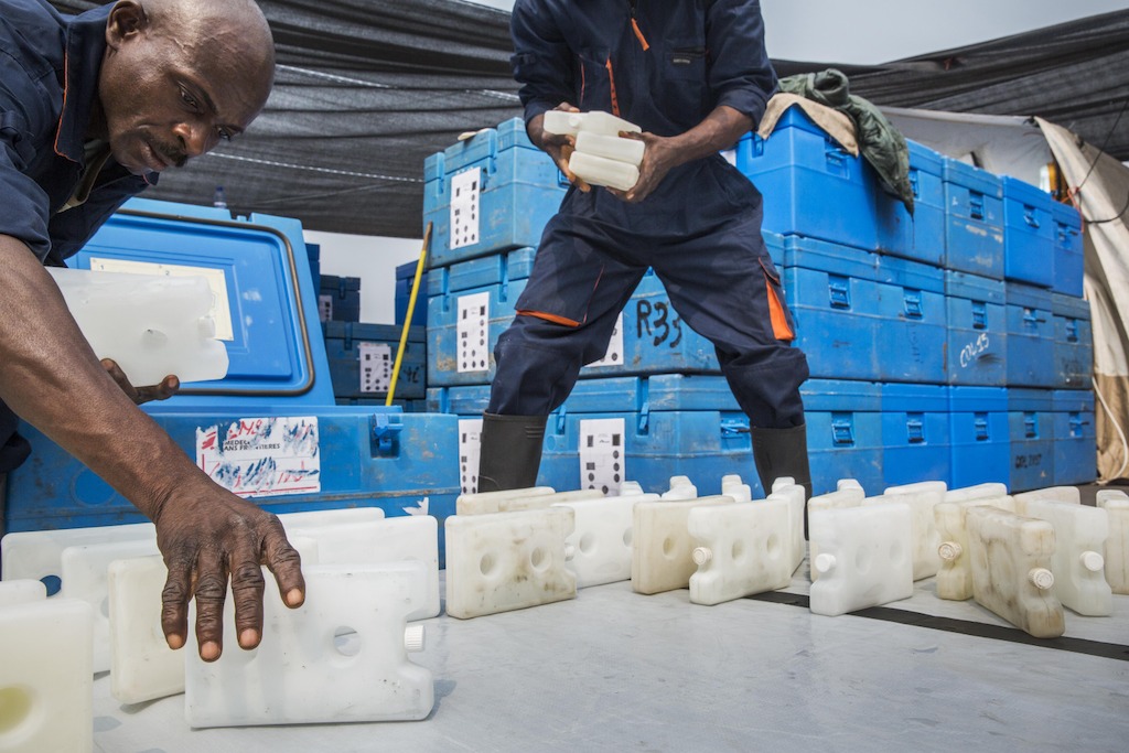 Medecins Sans Frontieres (MSF) staff stock 17.000 icepacks in cooler containers. <br/><br/>The icepacks are cooled at a temperature of minus 22. Before being stored in blue boxes with the vaccines. They are spread out in the sun till they reach a temperature of 0°C. As the vaccines have to be kept at the temperature between +2 and +8°C. Photographer: Dieter Telemans