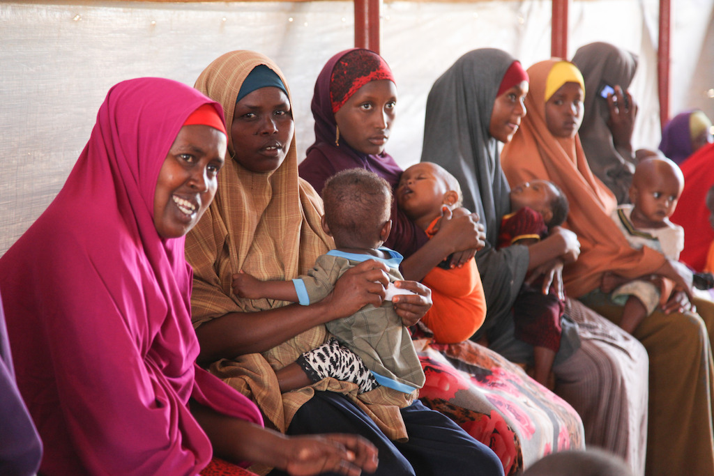 Women and children wait to be attended to at one of MSF's four health posts in Dagahaley refugee camp, Dadaab, Kenya. Photographer: Tom Maruko
