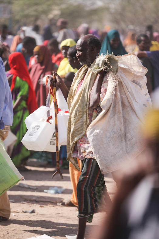 Refugees gather near the food distribution point in Dagahaley refugee camp, Dadaab, Kenya. Photographer: Tom Maruko