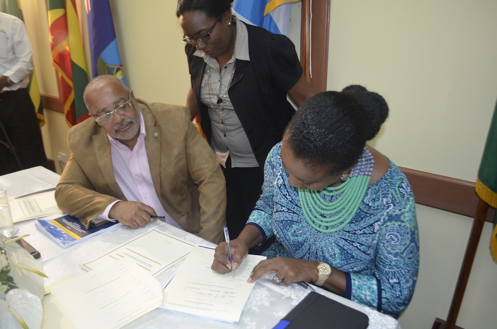 Ms. Shirlene Nibbs signing the ECIT Partnership Agreement on behalf of the ABHTI.