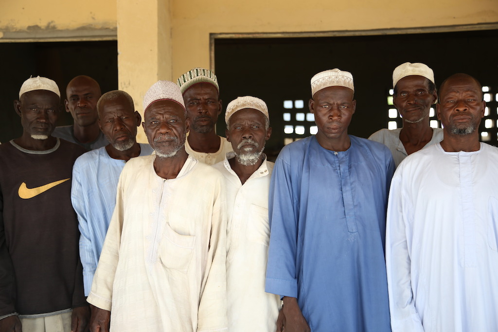 A group of men stand in the compound where MSF runs a hospital in the Nigerian town of Pulka, in the northeastern Borno state. Photographer: Igor Barbero