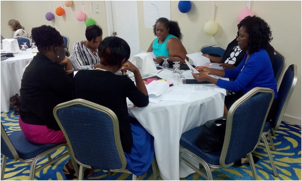 Team Antigua and Barbuda engage in discussions.