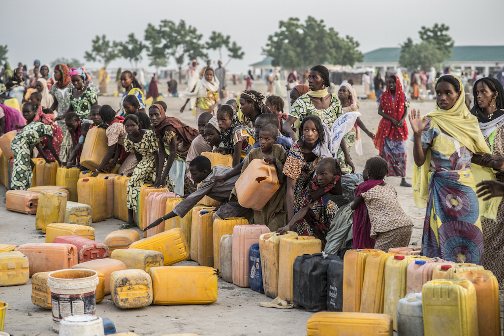 Every morning the camp residents rush to fill their water buckets.<br/>Access to water is a major problem for the displaced. Photographer: Sylvain Cherkaoui