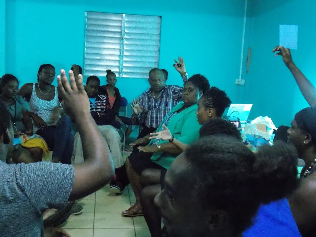 Active participation from community members in training session.