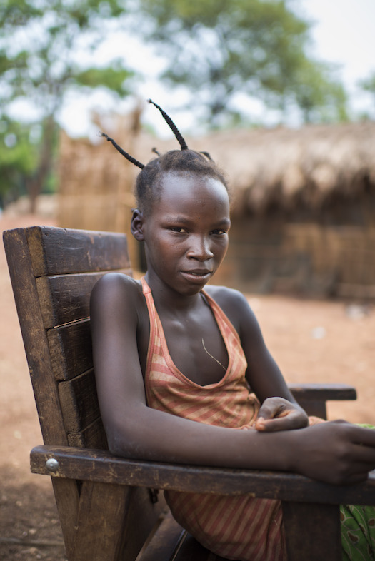 Credit Colin Delfosse. Solange, 12, Aviation IDP camp, Bambari. She was living with her grandparents when her village was attacked . “They killed whole families, so together with twenty other villagers we fled to hide in the bush. We slept on mats made of leaves and ate what we could find”. She reunited with her mother at Aviation IDP camp. Solange would like to be a nurse when she grows up.
