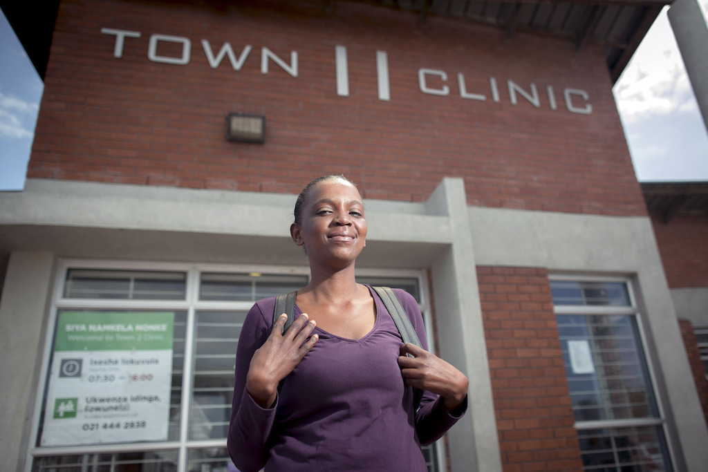 Sibongile leaves the Town 2 Clinic following her consultation. Kuyasa, Khayelitsha, Western Cape, South Africa.<br/><br/>Simbongile’s current DR-TB regimen: bedaquiline, linezolid, clofazimine, terizidone, levofloxacin, pyrazinamide. Photographer: Sydelle WIllow Smith