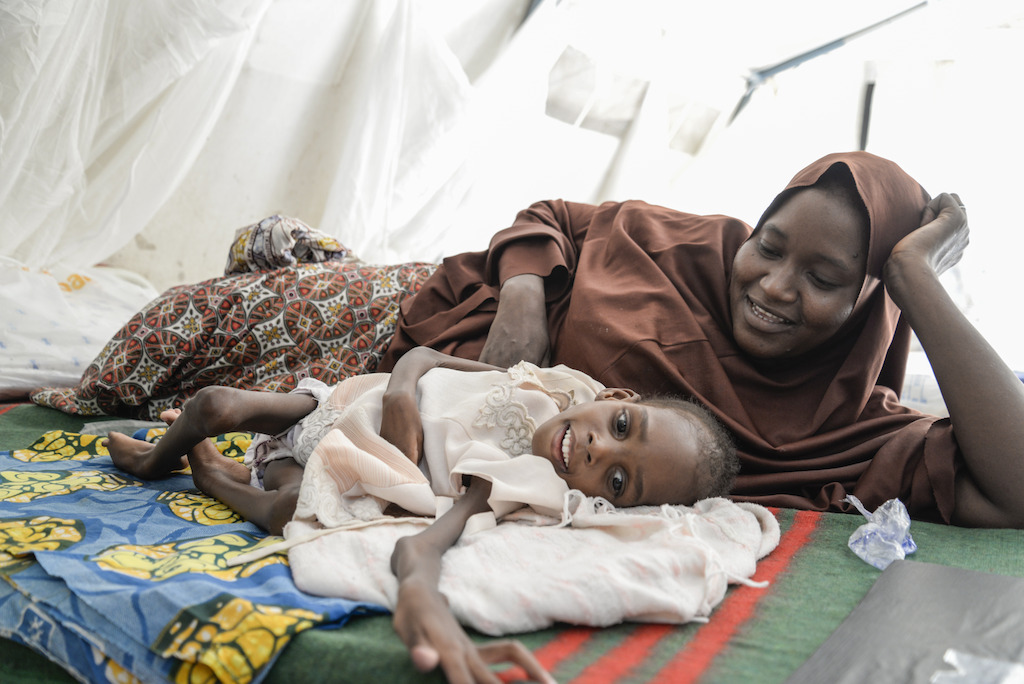 Amina Umar <br/><br/>Amina weighs 7,2 kg. She suffers from severe acute malnutrition accompanied by severe diarrhea and has chronic cerebral palsy. Amina began to develop an eating disorder when she started walking. At 8, she has been repeatedly hospitalized. <br/>She lives in the neighborhood Dambe Gidam in Maiduguri. His family is not experiencing particular difficulties in obtaining food but some days there are more than others.<br/>She is the third of five children. His siblings are healthy.<br/>Amina is at the ITFC of Gwange since 1 week.<br/><br/>On the picture Amina is with her mother, Amina. Photographer: Aurelie Baumel/