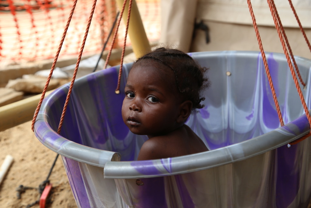 A young girl is weighed at the MSF inpatient therapeutic feeding centre in the northeastern Nigerian town of Banisheikh. Photographer: Igor Barbero