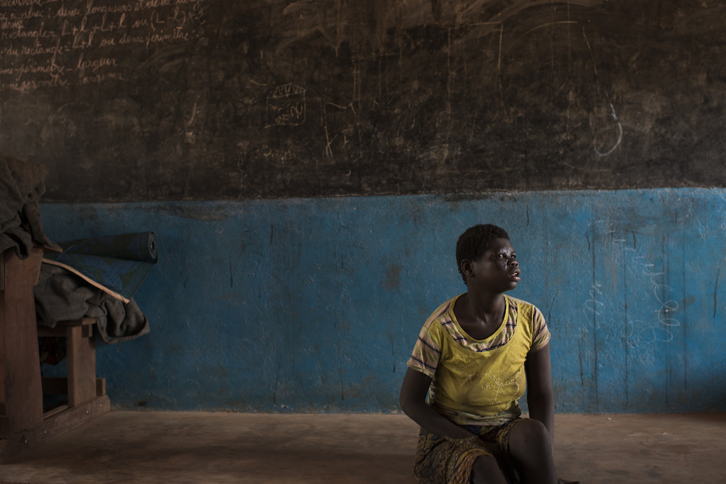Credit Colin Delfosse. Catherine, 16, fled her village with her parents and her fourteen brothers and sisters after it was burned. They found shelter in the village of Ngoubi's school, 18km from Bria.