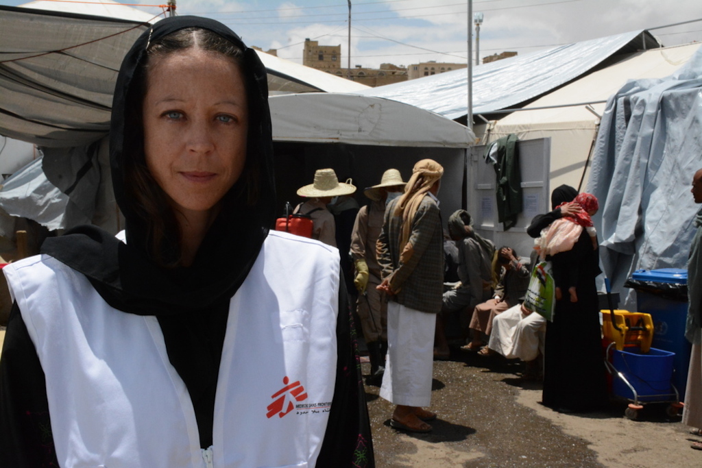 MSF project coordinator Claire Manera in front of MSF cholera treatment center in Khamer town, Amran. MSF is receiving an increased number of cholera patients in Yemen since the beginning of May 2017. This cholera treatment center alone, treated more than 1200 patients in less than two weeks. The center is still receiving an increased number of patients. Photographer: Malak Shaher/MSF