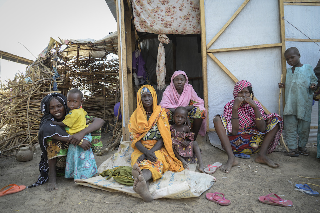 Food Distribution in the IDP site of Goni Kachallari in Maiduguri north-east of Nigeria. 340 families received a ration for one month.<br/>The Goni Kachallari IDP site is an informal camp where MSF delivery food, since August 2016 MSF gave 1 month ration food to 17 700 families in the Borno State.<br/>The one month ration food include 5 liters of oil, 5 kg of beans, 25 kg of millet. Photographer: Aurelie Baumel
