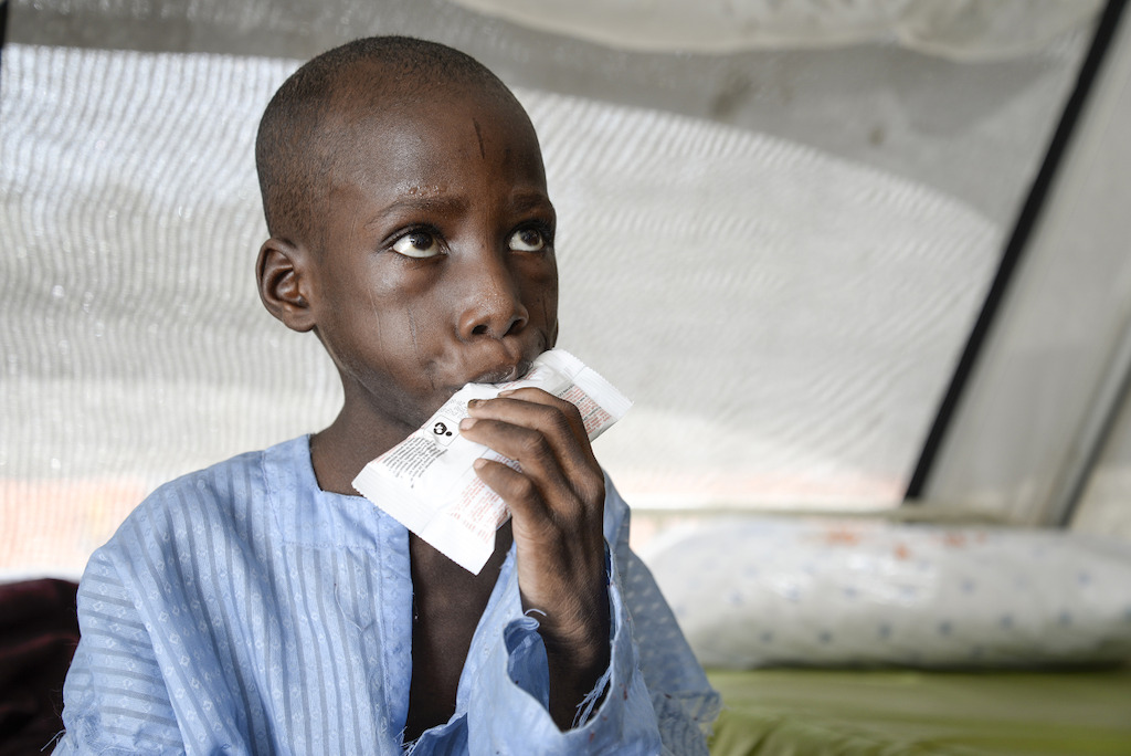 Bintou Kadiri, 8 years. He weighs 12.8 kg. His father is a farmer. His family lived in Kattere but she fled to Gajigana four months ago. Since one year, Boko Haram men came regularly to their villages to loot, but they never attacked the village. Therefore, people didn’t leave and the army is not present in the village. Boko Haram took their cows and 20 goats, together with food and money. In Gajigana, they live with relatives. Bintou is suffering from severe acute malnutrition (marasmus) and acute gastroenteritis, hypoglycemia and dehydration. He was hospitalized for two days to nutritional treatment center of Gwange in Maiduguri. The family left him with what remained of food, they had grown. But these reserves are coming to an end. Photographer: Aurelie Baumel/