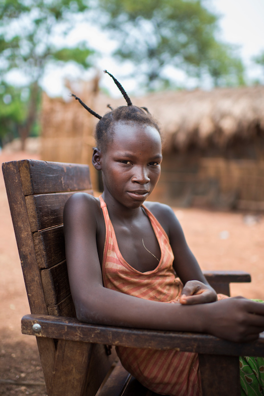 Solange, 12, Aviation IDP camp, Bambari. She was living with her grandparents when her village was attacked . “They killed whole families, so together with twenty other villagers we fled to hide in the bush. We slept on mats made of leaves and ate what we could find”. She reunited with her mother at Aviation IDP camp. Solange would like to be a nurse when she grows up. Photographer: Colin Delfosse