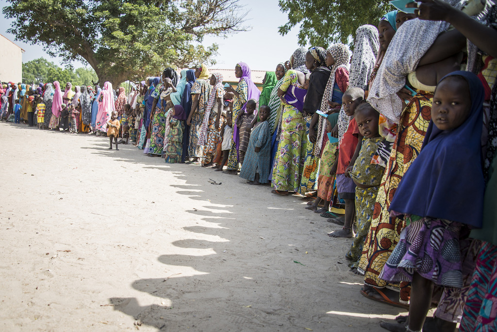 Food Distribution in the IDP site of Goni Kachallari in Maiduguri north-east of Nigeria. 340 families received a ration for one month.<br/>The one month ration food include 5 liters of oil, 5 kg of beans, 25 kg of millet. Photographer: Aurelie Baumel