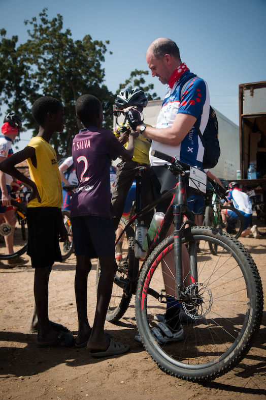 Hans Bourlon lets local kids check out his bike