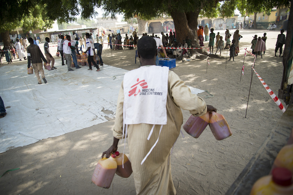 Food Distribution in the IDP site of Goni Kachallari in Maiduguri north-east of Nigeria. 340 families received a ration for one month.<br/>The one month ration food include 5 liters of oil, 5 kg of beans, 25 kg of millet. Photographer: Aurelie Baumel