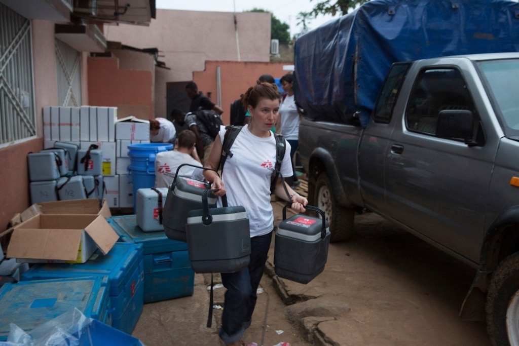 A Medecins Sans Frontieres (MSF) staff member carries cold boxes containing yellow fever vaccines on the first day of the vaccination programme in Matadi, DRC. Photographer: MSF
