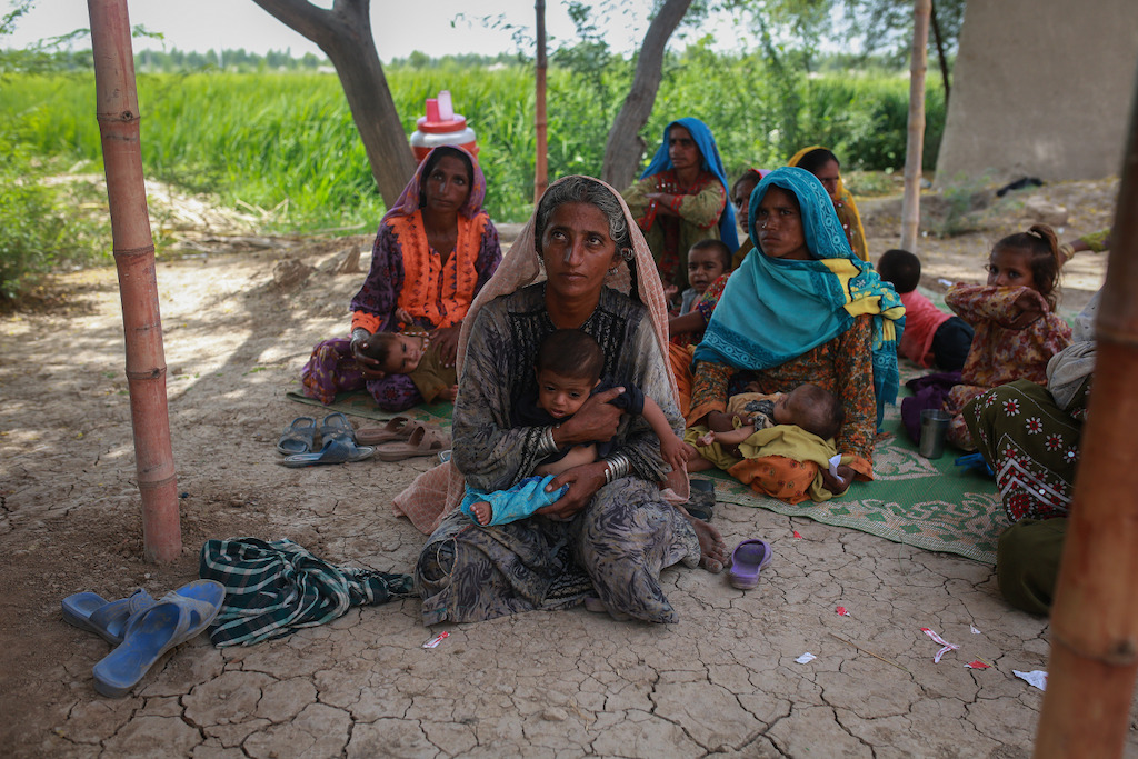 Muradi hold her eighteenth child as she wait for a checkup at the mobile clinic set up at Sikandarabad, district Naseerabad in Balochistan province, Pakistan. Photographer: Sara Farid