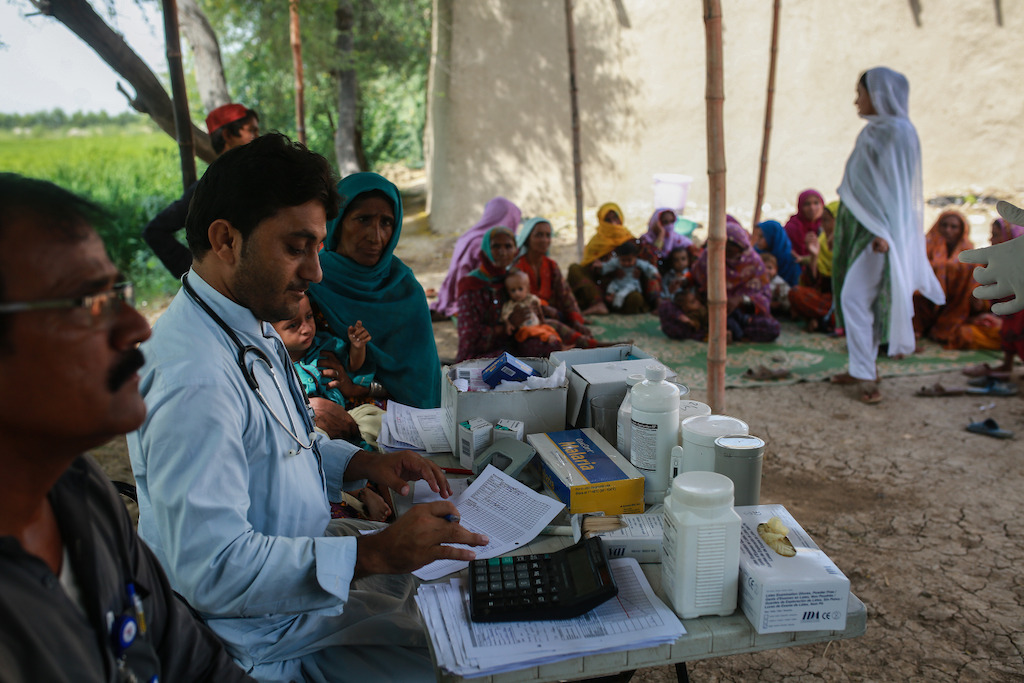 Women wait to have their babies checked for malnutrition at the mobile clinic run by MSF at Sikandarabad in district Naseerabad in Balochistan province, Pakistan. Photographer: Sara Farid