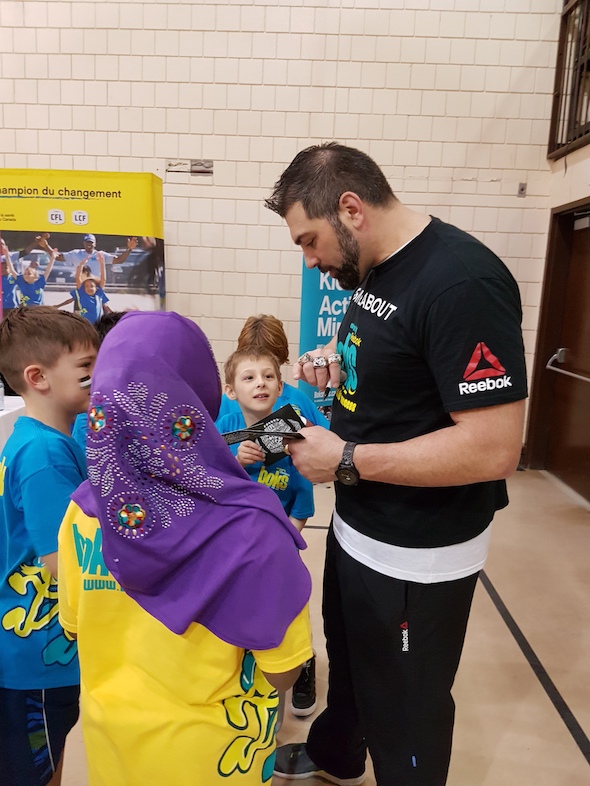 Randy Chevrier signing autographs at Ecole Centennial Community School