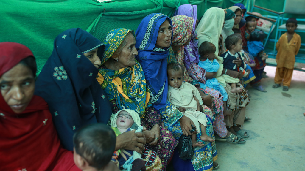 Mothers with their babies wait outside the ambulatory therapeutic feeding centre<br/>(ATFC) run by MSF at the DHQ hospital, Dera Murad Jamali in Balochistan province,<br/>Pakistan. Photographer: Sara Farid