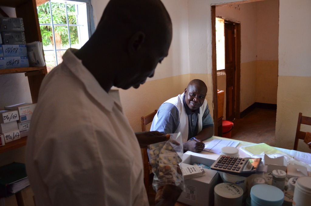 Nurse Pélé and a pharmacist in Mbalazime health centre do an inventory of the latest MSF supply delivery. Photographer: Sandra Smiley/MSF