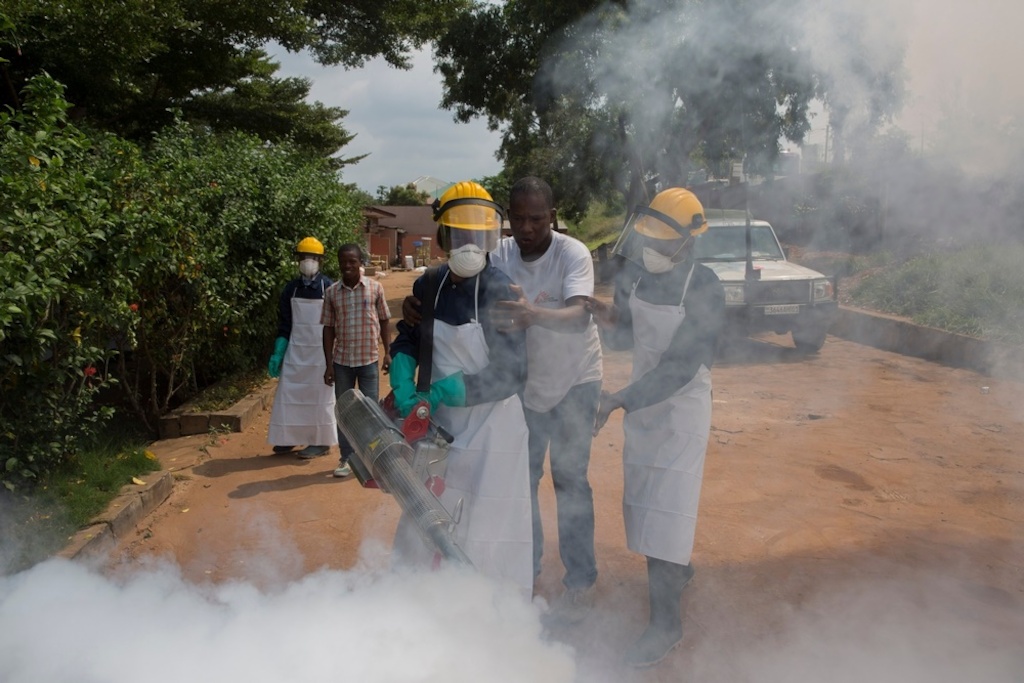 Medecins Sans Frontieres (MSF) staff members fumigate a neighbourhood in Matadi, during an operation to kill adult mosquitoes. Photographer: MSF